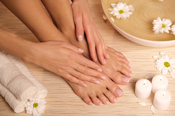 Luxurious manicure and pedicure in progress on elegant hands and feet